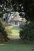 MISTY VIEW OF COTTAGE AT SWISS GARDEN,  SHUTTLEWORTH