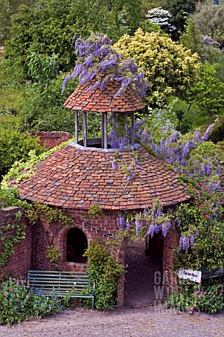 WISTERIA_CLAD_ENTRANCE_TOWER_AT_STONE_HOUSE_COTTAGE_GARDEN