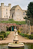 WISTERIA ARCH WITH VIEW TO HELMSLEY CASTLE AT HELMSLEY WALLED GARDEN