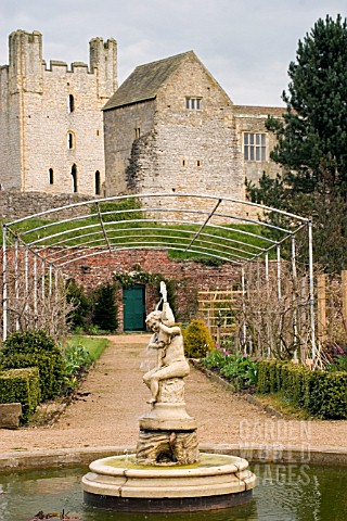WISTERIA_ARCH_WITH_VIEW_TO_HELMSLEY_CASTLE_AT_HELMSLEY_WALLED_GARDEN