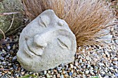 BUDDHA HEAD SCULPTURE WITH GRASS