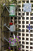 DECORATIVE MOSAIC PLANTED WATERING CANS ON METAL ETAGERE