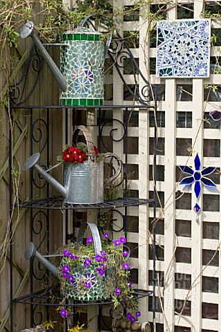 DECORATIVE_MOSAIC_PLANTED_WATERING_CANS_ON_METAL_ETAGERE