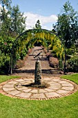 VIEW WITH ARMILLARY AT THE LABURNUM WALK AT THE GARDEN AT THE BANNUT,  BRINGSTY,  HEREFORDSHIRE,  MAY