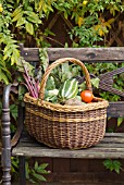 WICKER BASKET OF VEGETABLES CONTAINING MARROW, TOMATOES, CAULIFLOWER, BEETROOT AND POTATOES