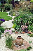 GARDEN CURVES OF GRAVEL BED AND LAWN.