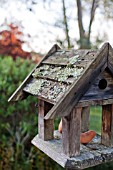 TERRACOTTA ORNAMENTS ON BIRD TABLE