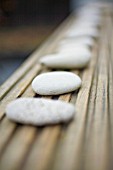 WHITE PEBBLES ON DECKING