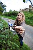 LADY PICKING BLACKBERRIES