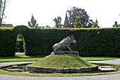 WILD BOAR STONE STATUE AT LES JARDINS DANNEVOIE; BELGIUM