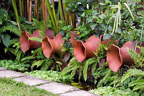 SHADY_WATER_FEATURE_WITH_CLAY_POTS_AT_LAKE_GARDENS_KUALA_LUMPUR_MALAYSIA