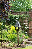 MIXED PLANTING COTTAGE BORDER WITH WOODEN BIRD FEEDER