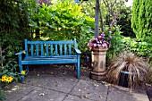 GARDEN BENCH IN SHADY CORNER