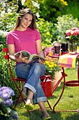 LADY ENJOYING AND RELAXING IN THE GARDEN