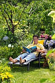 PEOPLE PERSONS ENJOYING BEING RELAXING IN THE GARDEN