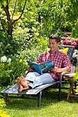 PEOPLE PERSONS ENJOYING BEING RELAXING IN THE GARDEN