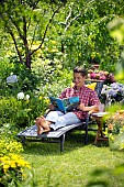 PEOPLE PERSONS ENJOYING BEING RELAXING IN THE GARDEN