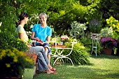 PEOPLE PERSONS ENJOYING BEING RELAXING IN THE GARDEN