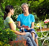 PEOPLE PERSONS ENJOYING BEING RELAXING IN THE GARDEN