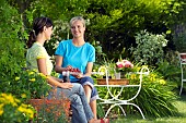 PEOPLE PERSONS ENJOYING BEING RELAXING IN THE GARDEN