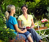 PEOPLE PERSONS ENJOYING BEING RELAXING IN THE GARDEN