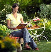 LADY ENJOYING AND RELAXING IN THE GARDEN