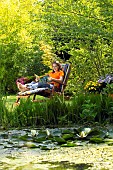 LADY ENJOYING AND RELAXING IN THE GARDEN