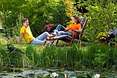 PEOPLE PERSONS ENJOYING BEING RELAXING IN THE GARDEN