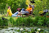 PEOPLE PERSONS ENJOYING BEING RELAXING IN THE GARDEN