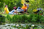 PEOPLE PERSONS ENJOYING BEING RELAXING IN THE GARDEN