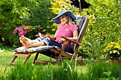 LADY ENJOYING AND RELAXING IN THE GARDEN