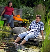 PEOPLE PERSONS ENJOYING BEING RELAXING IN THE GARDEN