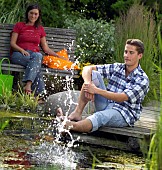 PEOPLE PERSONS ENJOYING BEING RELAXING IN THE GARDEN