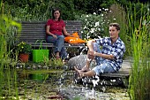 PEOPLE PERSONS ENJOYING BEING RELAXING IN THE GARDEN