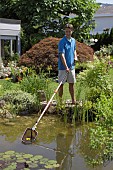 USING TELECOPIC NET FOR CLEANING POND