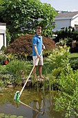 USING TELESCOPIC POND VACUUM