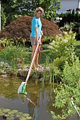 USING TELESCOPIC POND VACUUM