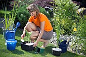 PLANTING UP BASKETS FOR POND