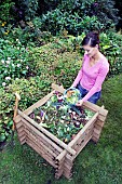 ADDING VEGETABLE WASTE TO COMPOST HEAP