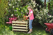 MAKING COMPOST - ADDING VEGETABLE WASTE