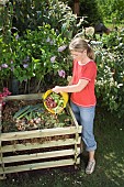 MAKING COMPOST - ADDING VEGETABLE WASTE