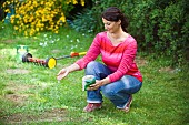 LAWN ACTION SPREADING GRASS SEED BY HAND