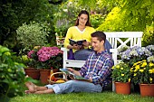 PEOPLE PERSONS ENJOYING BEING RELAXING IN THE GARDEN