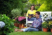 PEOPLE PERSONS ENJOYING BEING RELAXING IN THE GARDEN