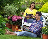 PEOPLE PERSONS ENJOYING BEING RELAXING IN THE GARDEN