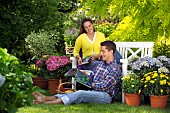 PEOPLE PERSONS ENJOYING BEING RELAXING IN THE GARDEN