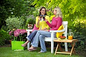 PEOPLE PERSONS ENJOYING BEING RELAXING IN THE GARDEN