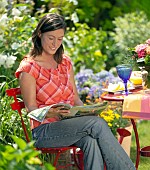 LADY ENJOYING AND RELAXING IN THE GARDEN