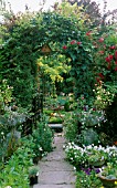 PATHWAY LEADING TO OPEN GATE,  GARDEN BEYOND