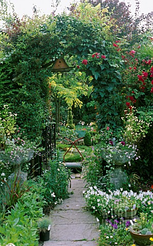 PATHWAY_LEADING_TO_OPEN_GATE__GARDEN_BEYOND